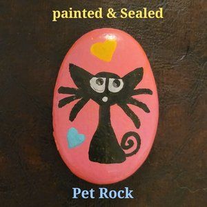 Black cat on a hot pink background hand painted pet rock.